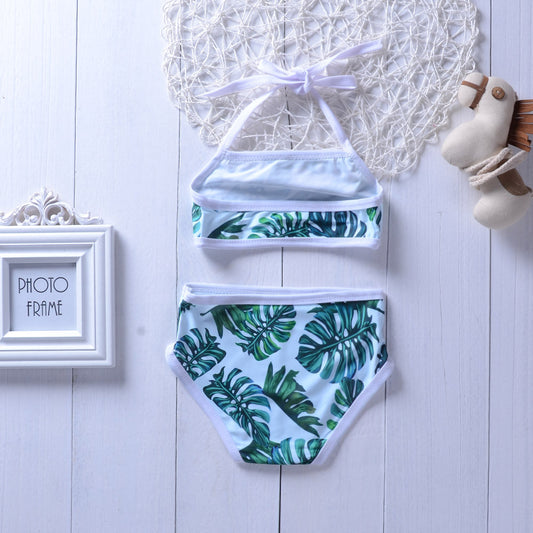 baby girls 2-piece swimsuit with tropical leaf design, perfect for summer pool days and beach holidays.