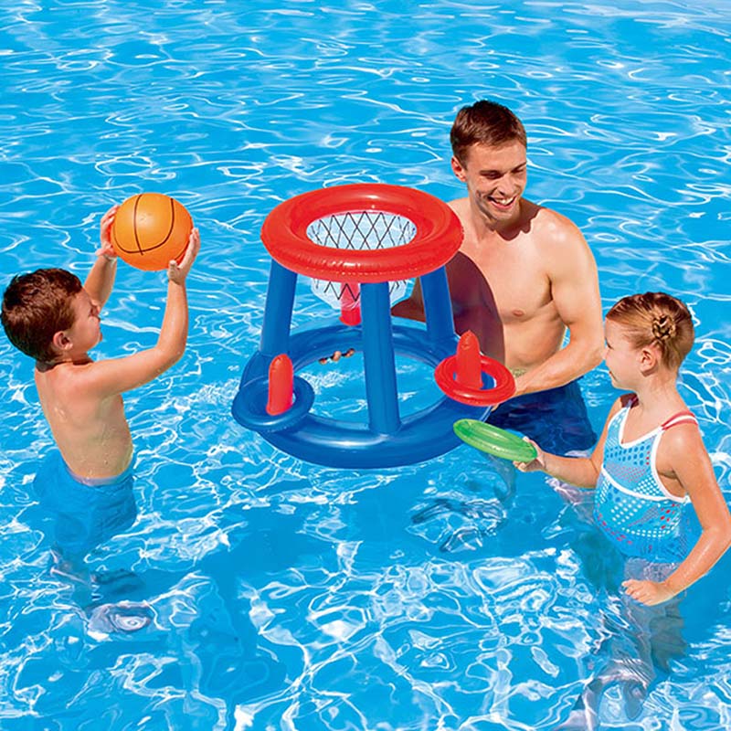Family playing with a floating basketball hoop and inflatable pool ring toss game