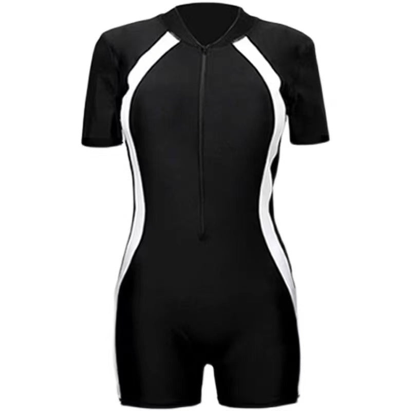 Kids one-piece swimsuit in black with short sleeves and white accents, ideal for swimming and water activities.