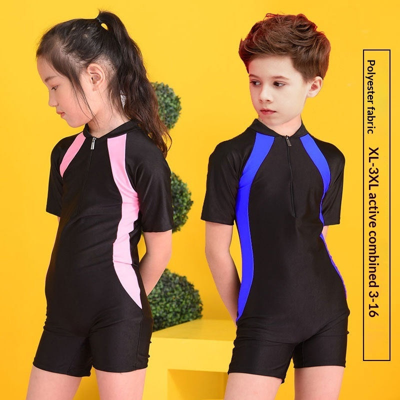 Kids one-piece swimsuit featuring short sleeves, designed for active boys and girls, perfect for swimming and water sports.